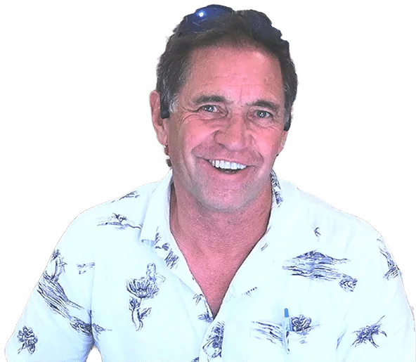 Tom McKay, smiling, in a casual shirt